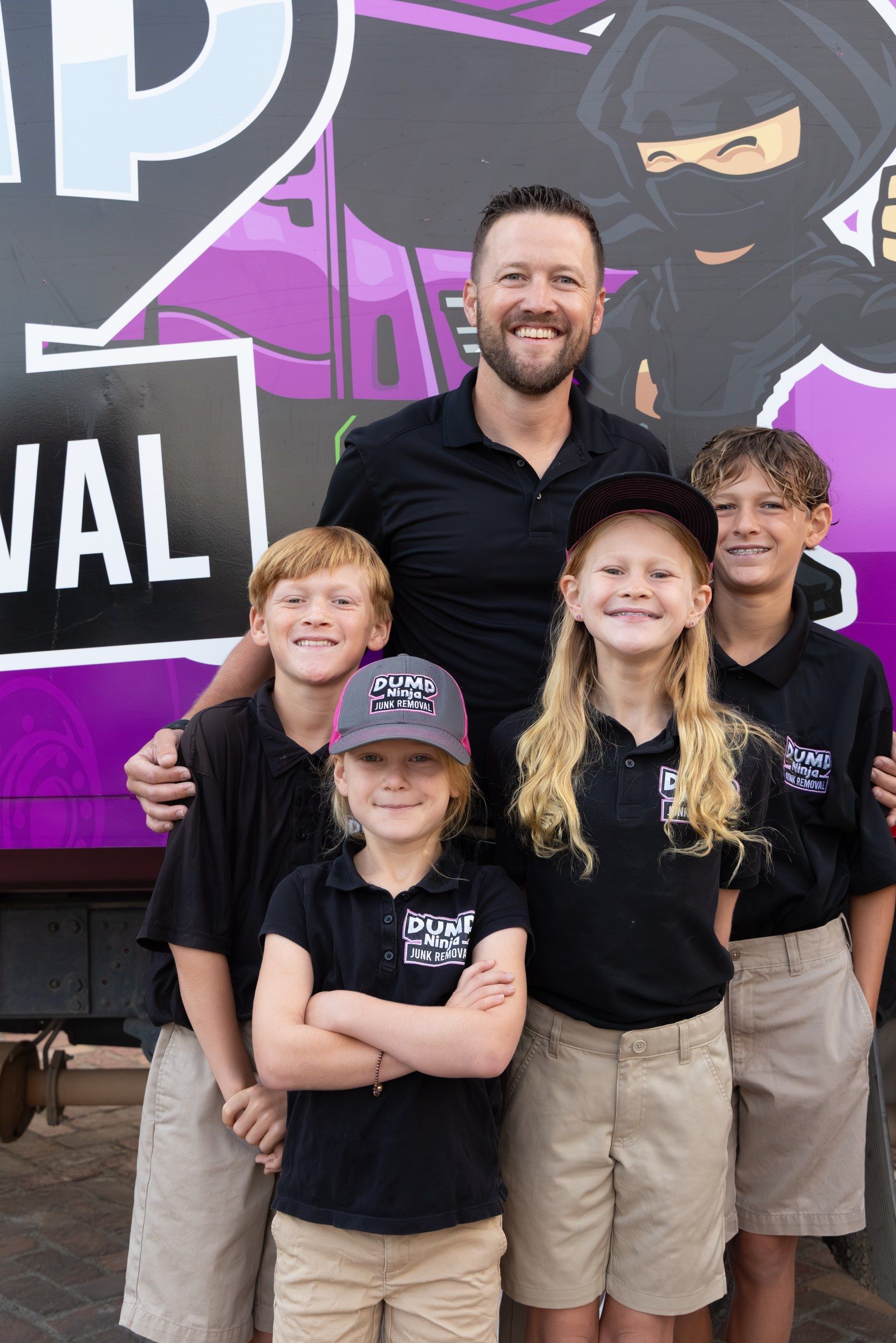 Two of the Mahan kids in Dump Ninja shirts and caps