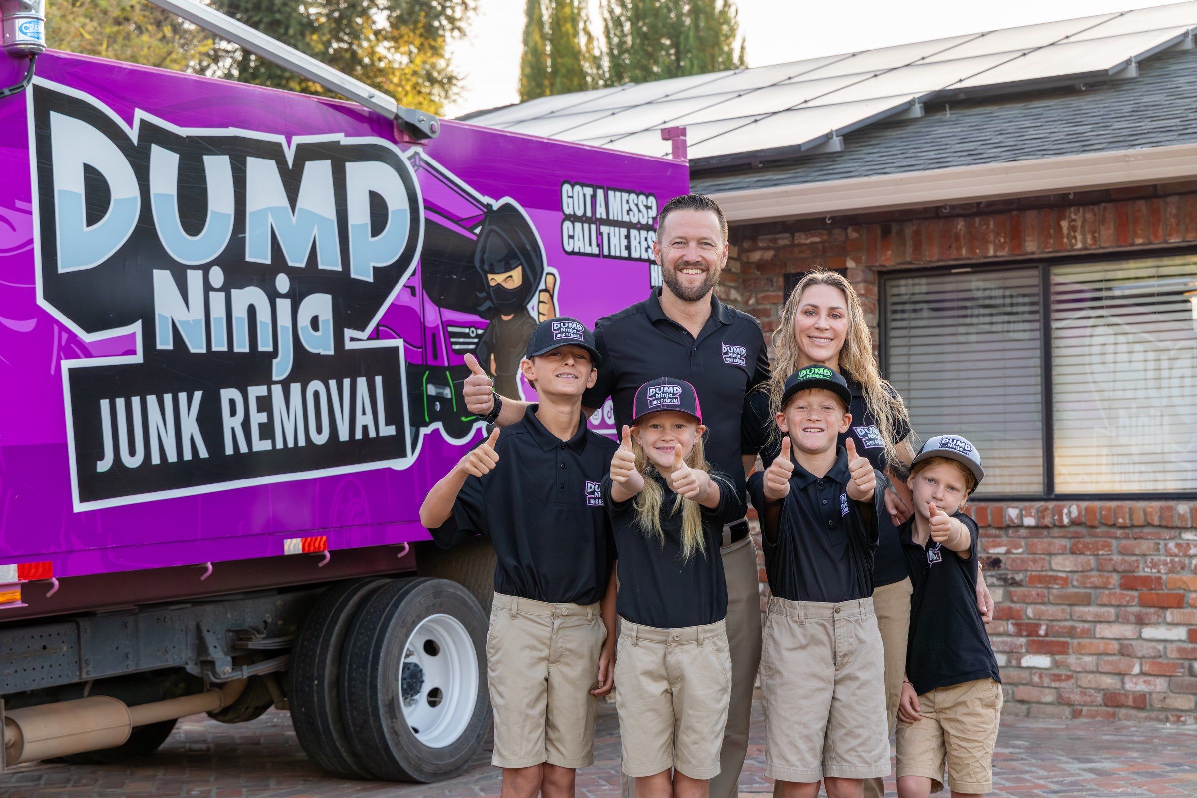 The Mahan family standing in front of the Dump Ninja truck at their Woodland home